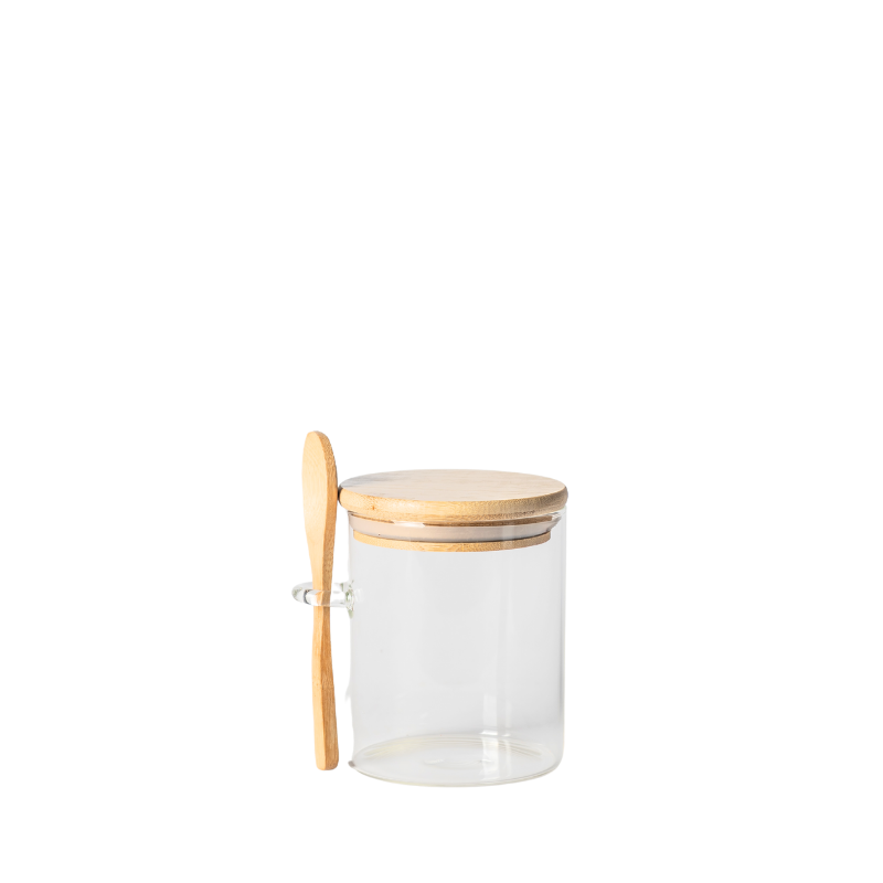 glass jar with spoon and bamboo lid